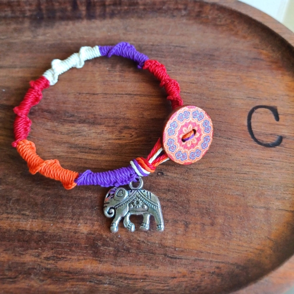 Brand new, handmade Brazilian wax string bracelet with button and charm!